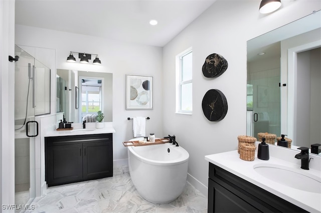 bathroom with vanity and independent shower and bath