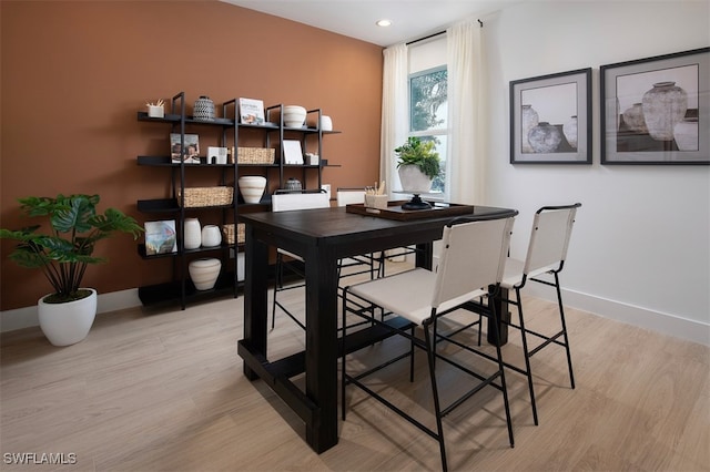 dining room with light hardwood / wood-style floors