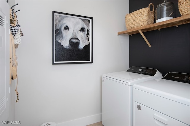 laundry area featuring washing machine and clothes dryer