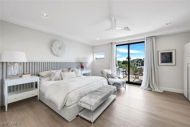 bedroom featuring light hardwood / wood-style flooring and access to outside