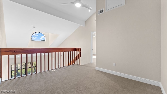 hall with beamed ceiling, carpet, and high vaulted ceiling