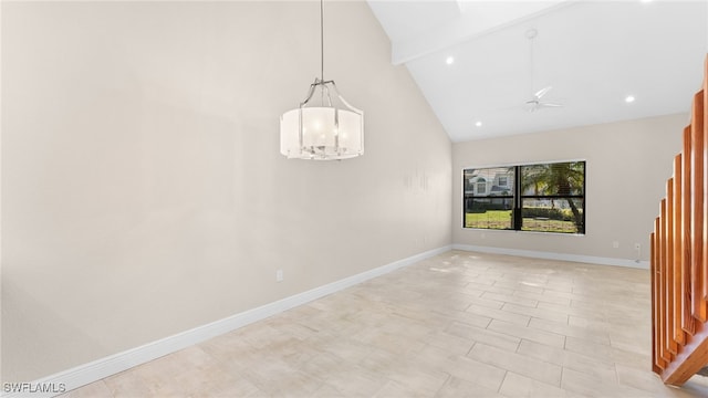 unfurnished dining area featuring ceiling fan with notable chandelier and high vaulted ceiling