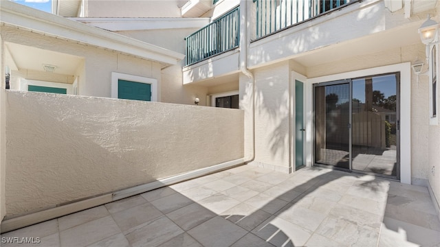 view of patio with a balcony