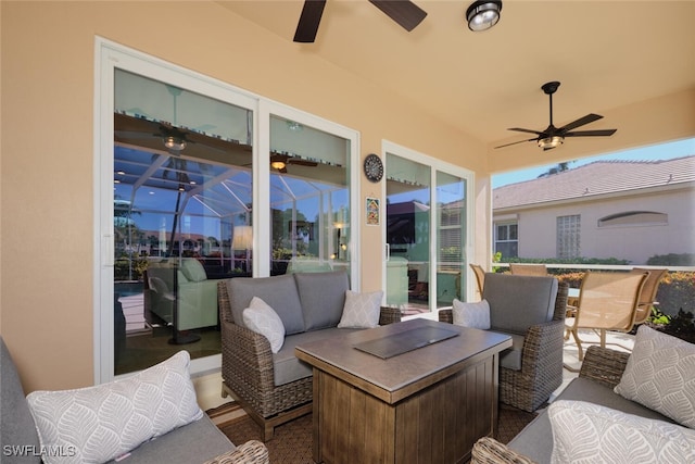 view of patio featuring outdoor lounge area and glass enclosure