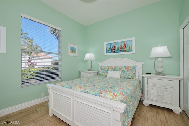 bedroom with light hardwood / wood-style flooring