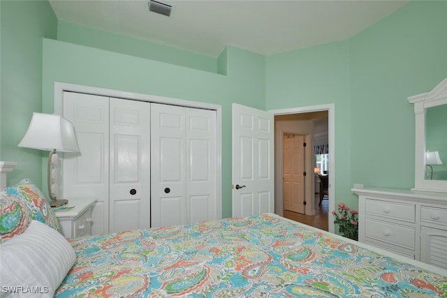 bedroom featuring hardwood / wood-style flooring and a closet