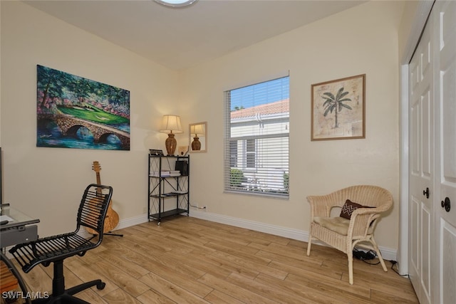 office with light wood-type flooring