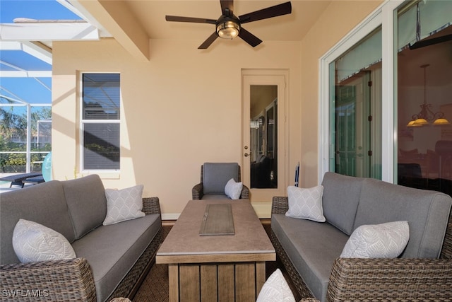 view of patio / terrace with glass enclosure, an outdoor living space, and ceiling fan