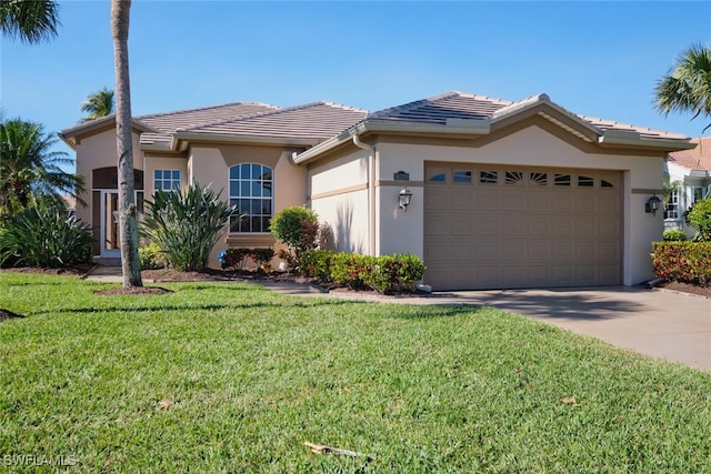 view of front facade with a garage and a front lawn