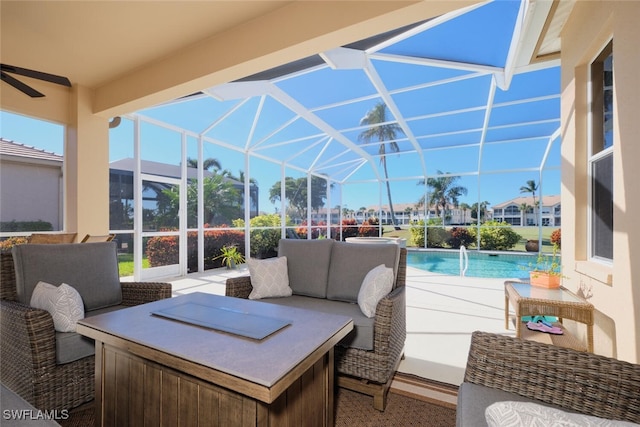 view of patio featuring glass enclosure and outdoor lounge area