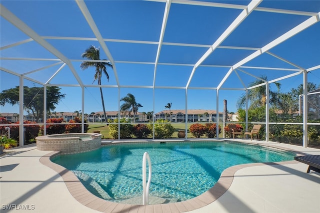 view of pool with a lanai, an in ground hot tub, and a patio