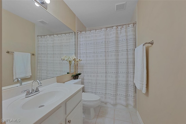 bathroom with tile patterned flooring, vanity, toilet, and curtained shower