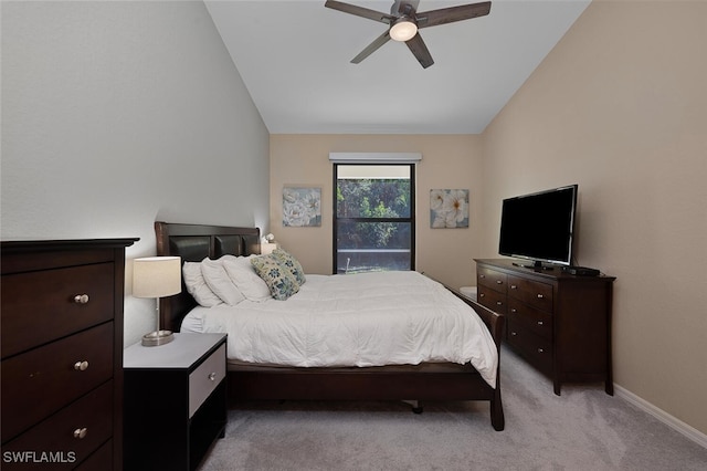 bedroom with light colored carpet, ceiling fan, and lofted ceiling