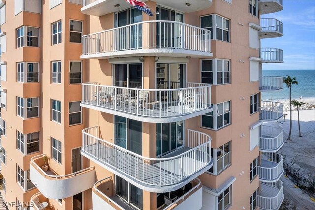 view of building exterior with a water view