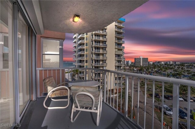 view of balcony at dusk