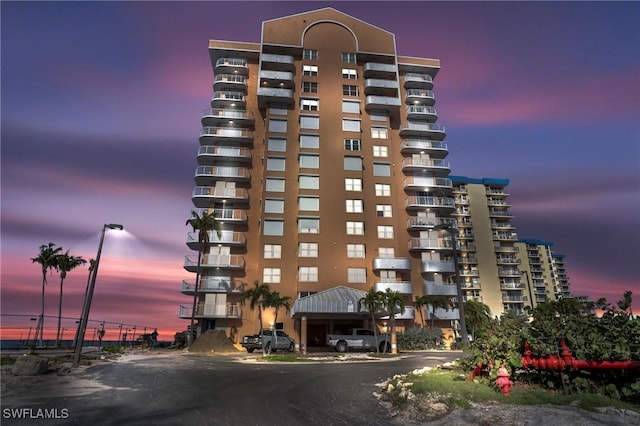 view of outdoor building at dusk