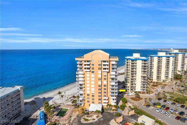 aerial view featuring a water view and a beach view