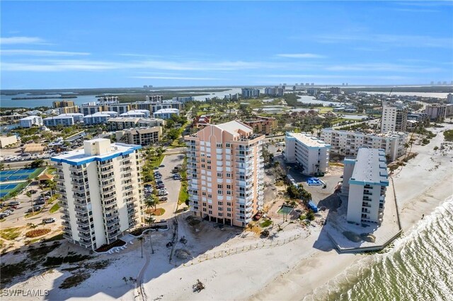 drone / aerial view with a beach view and a water view