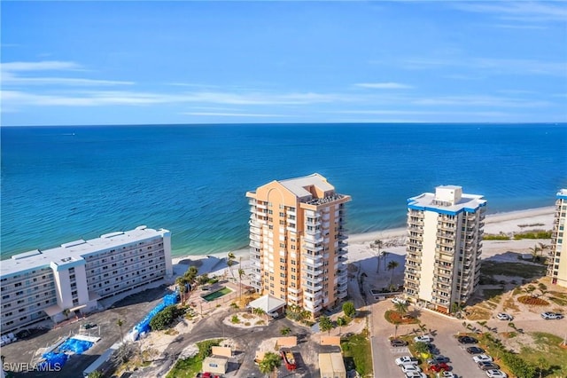 aerial view featuring a view of the beach and a water view