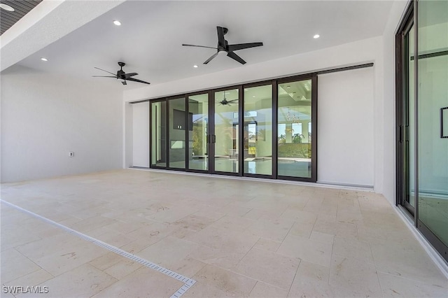 interior space with ceiling fan