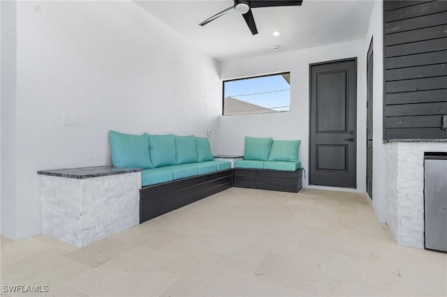 unfurnished living room featuring ceiling fan