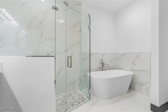 2123 SW 52nd Ter, Cape Coral, FL 33914 - bathroom with marble tiled floors, a freestanding bath, a marble finish shower, and a wainscoted wall