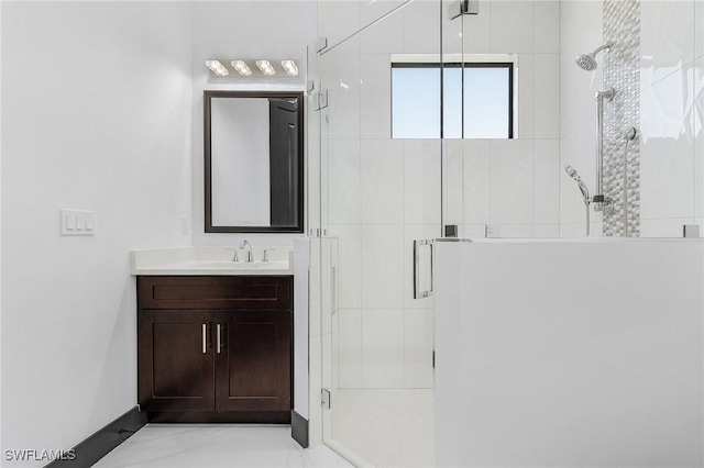 bathroom with vanity and walk in shower