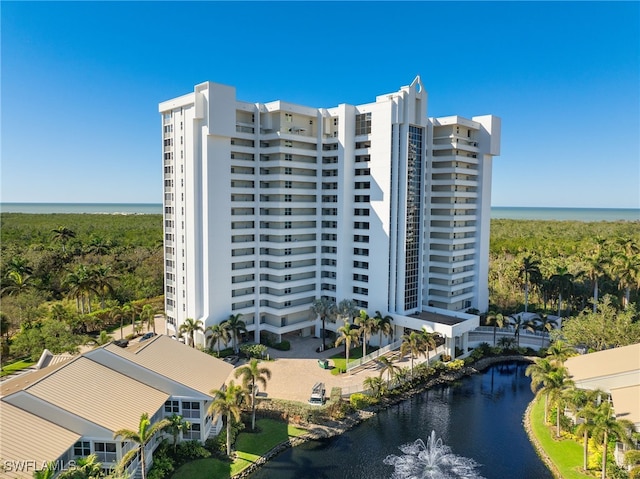 view of building exterior with a water view