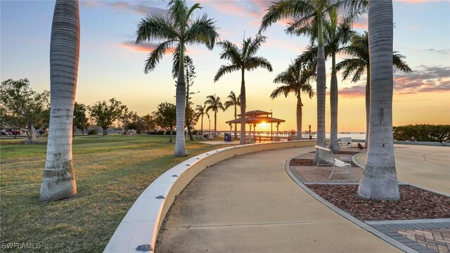 view of property's community with a gazebo and a yard