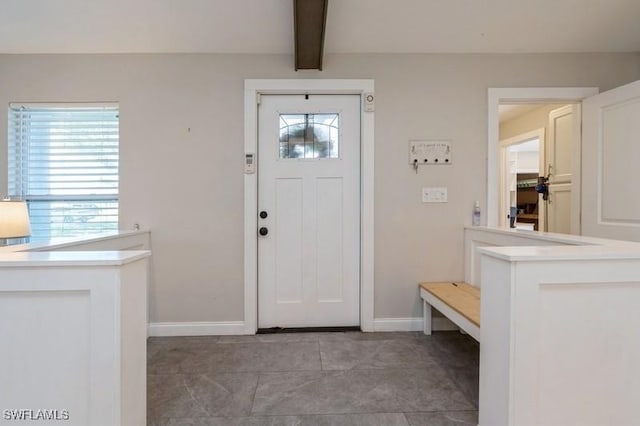 foyer with beam ceiling