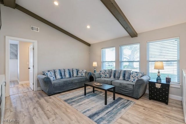 living room featuring lofted ceiling and light wood-type flooring