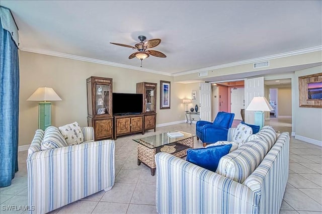 tiled living room with ceiling fan and crown molding