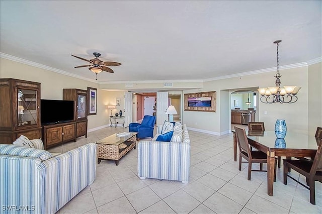 living room featuring ceiling fan with notable chandelier, crown molding, and light tile patterned flooring