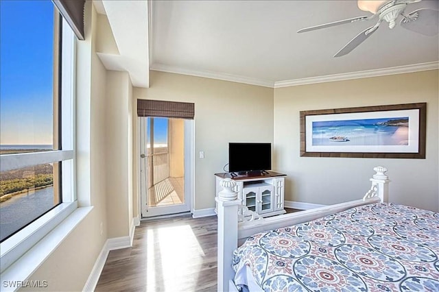 bedroom featuring wood-type flooring, ceiling fan, and crown molding