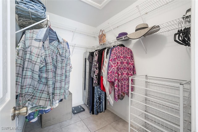 spacious closet with tile patterned floors