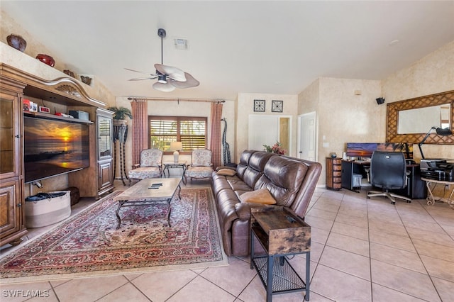 tiled living room with ceiling fan