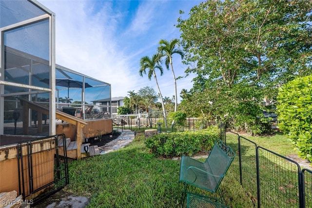 view of yard with a lanai