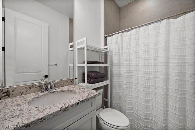 bathroom with vanity and toilet