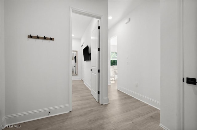 hallway with light wood-type flooring