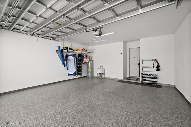 garage featuring a garage door opener and water heater