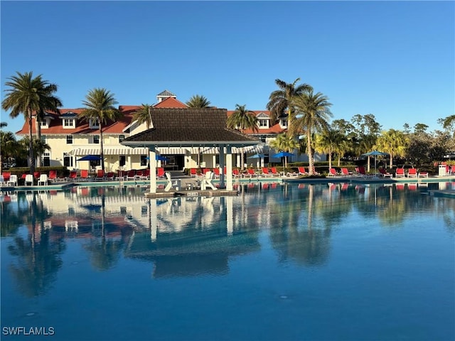 view of pool with a water view