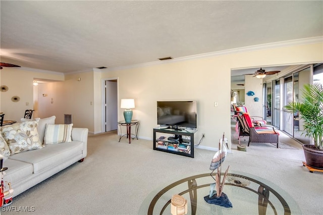 living room featuring crown molding, visible vents, a ceiling fan, and carpet flooring