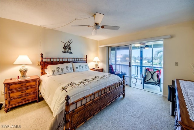 bedroom with access to exterior, carpet floors, and a ceiling fan