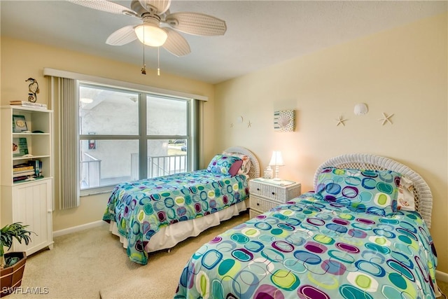 carpeted bedroom featuring ceiling fan and baseboards