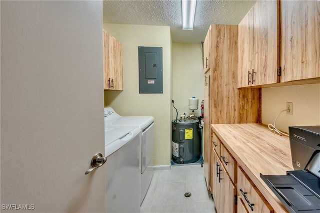 laundry room with cabinet space, light tile patterned floors, electric panel, washer and dryer, and water heater