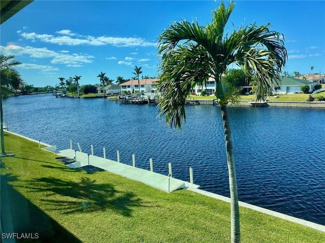 property view of water featuring a dock and a residential view