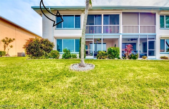 4026 SE 12th Ave Unit 208, Cape Coral, FL 33904 - back of house with a lawn and stucco siding