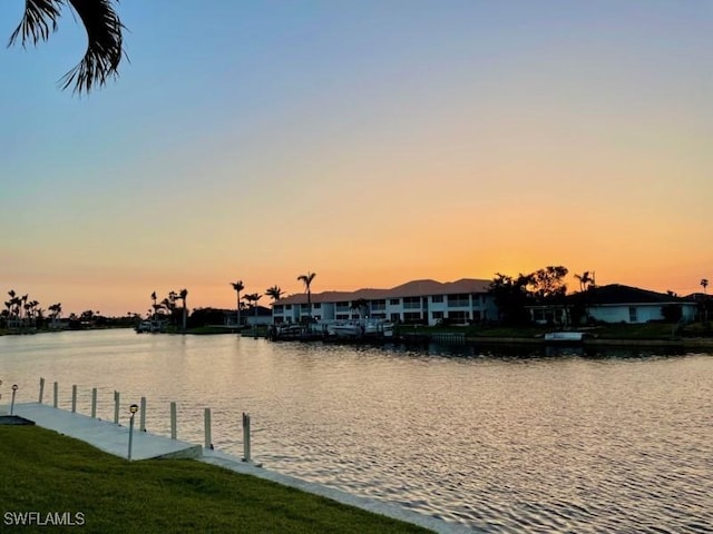 view of water feature featuring a dock and a residential view
