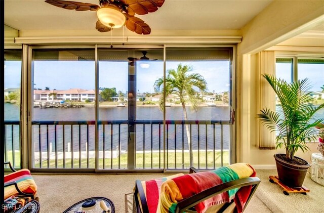 4026 SE 12th Ave Unit 208, Cape Coral, FL 33904 - sunroom / solarium featuring a water view and carpet