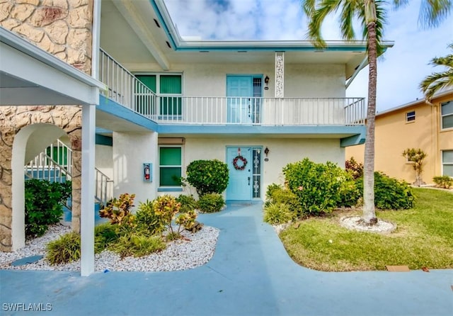 4026 SE 12th Ave Unit 208, Cape Coral, FL 33904 - view of front of property featuring stucco siding and a balcony